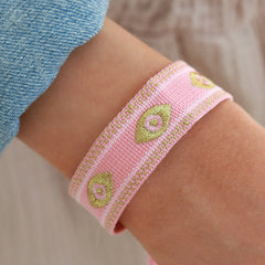 Woven bracelet evil eye pink