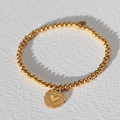 Armband gouden bal hart