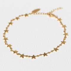 Tobillera dorada con estrellas