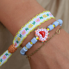 Gewebtes Armband Baumwolle Blume weiß/gelb