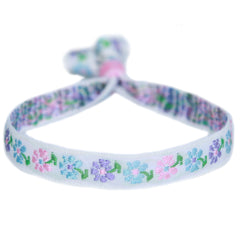 Pulsera tejida pequeña flor pastel