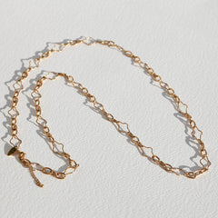 Long collier trèfle en or