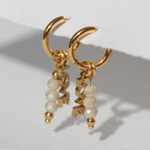 Gold faceted 'Love' earrings – cream