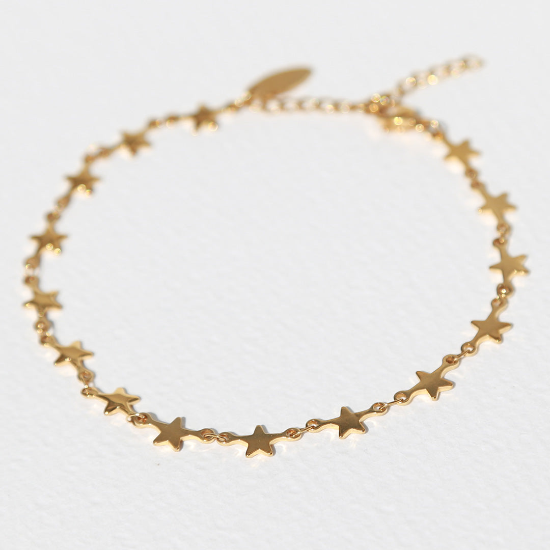 Tobillera dorada con estrellas