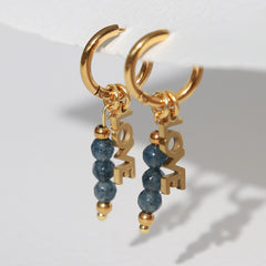Boucles d'oreilles en or facettées amour bleu