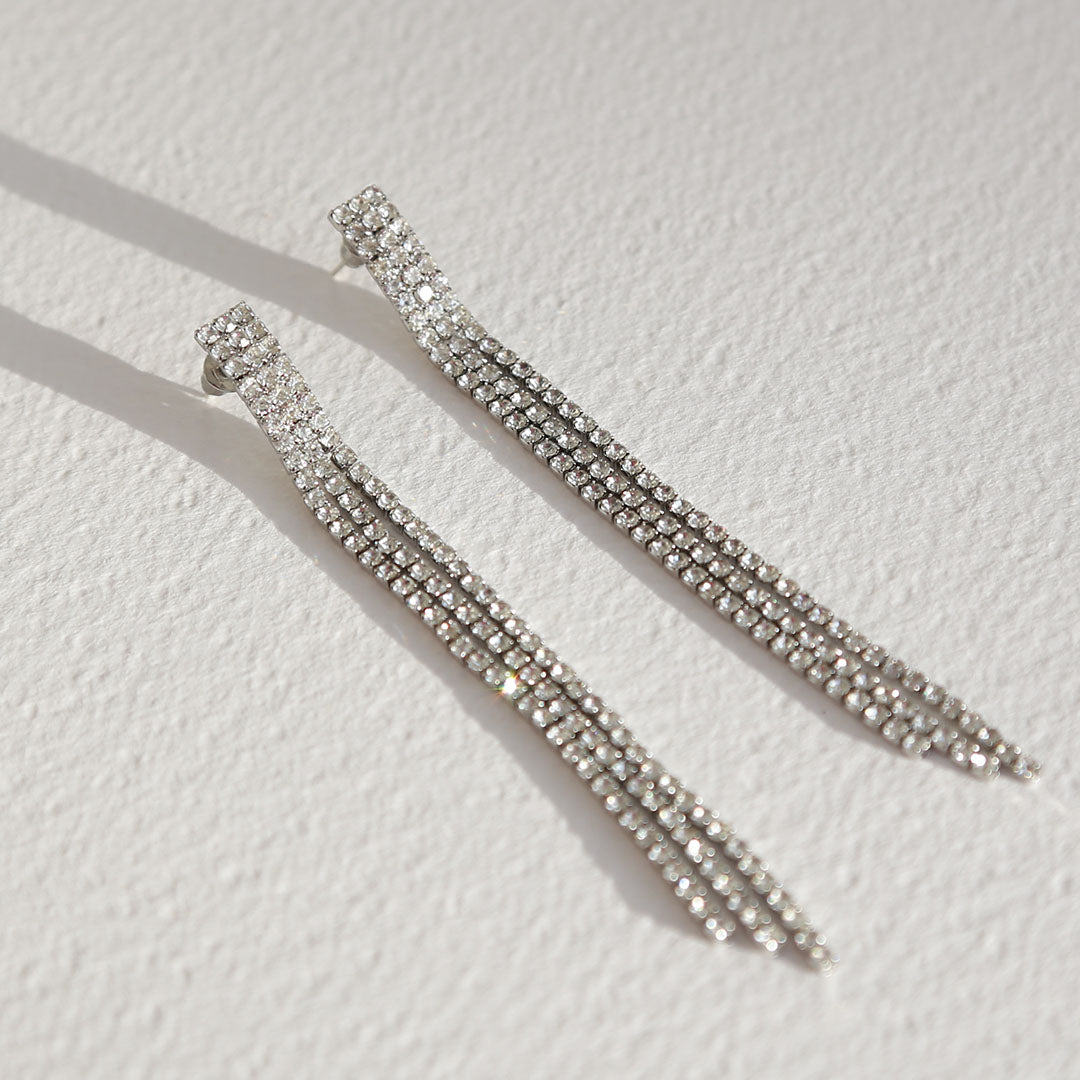 Gold earrings covered in diamonds