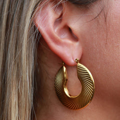 Golden earrings flat lines