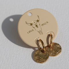 Boucles d'oreilles en or représentant le soleil, la lune et les étoiles