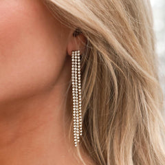 Gold earrings covered in diamonds